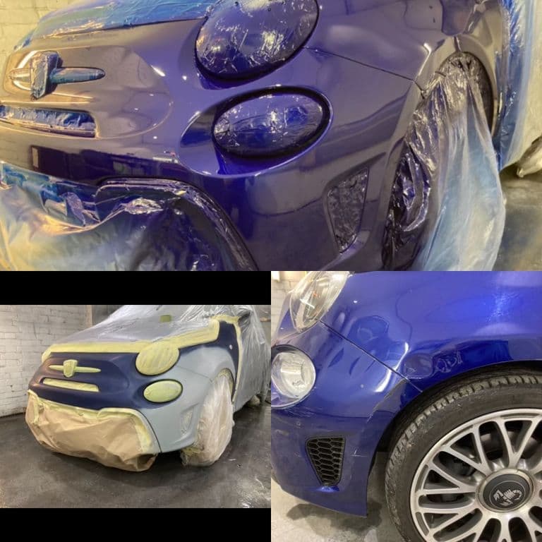 Automotive professionals completing paintwork